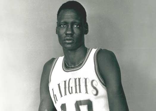 Manute Bol in UB Purple Knights basketball uniform